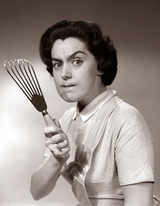 1950S-60S Portrait Of Angry Housewife Brandishing Spatula At Camera