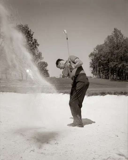 1960S Man Playing Golf Chipping Golf Ball Out Of A Sand Trap Outdoor