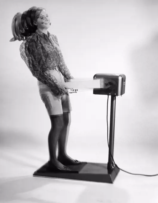 1960S Woman Massaged By Vibrating Exercise Machine