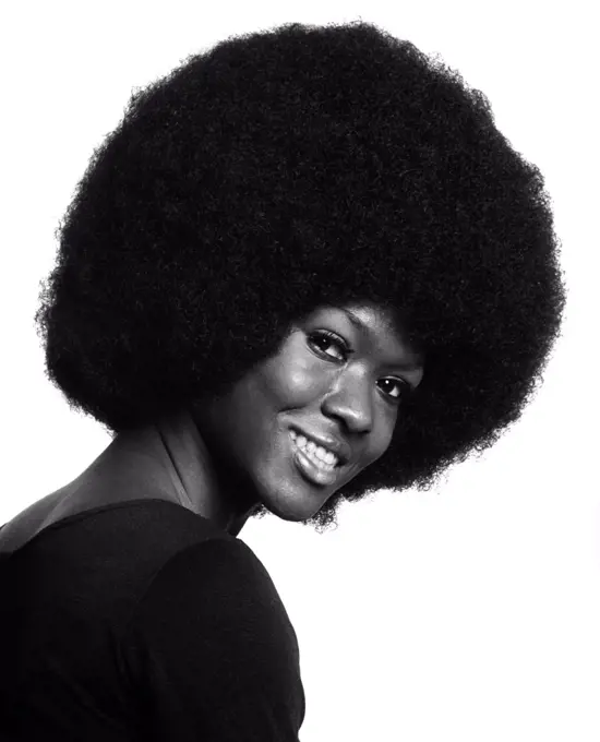 1970S Portrait Of Smiling Black Woman With Large Afro Leaning Into Frame From Side