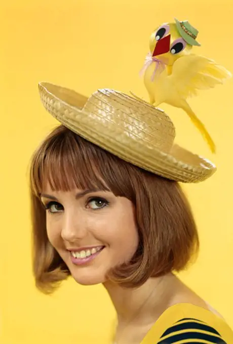 1960S Portrait Brunette Young Woman Wearing Silly Straw Hat Easter Bonnet With Toy Chick On Top