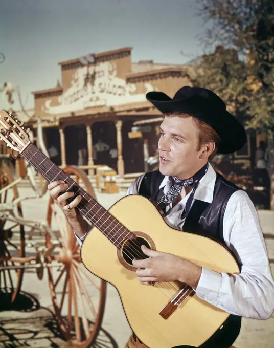 1960S Man Cowboy Strumming Country And Western Acoustic Guitar