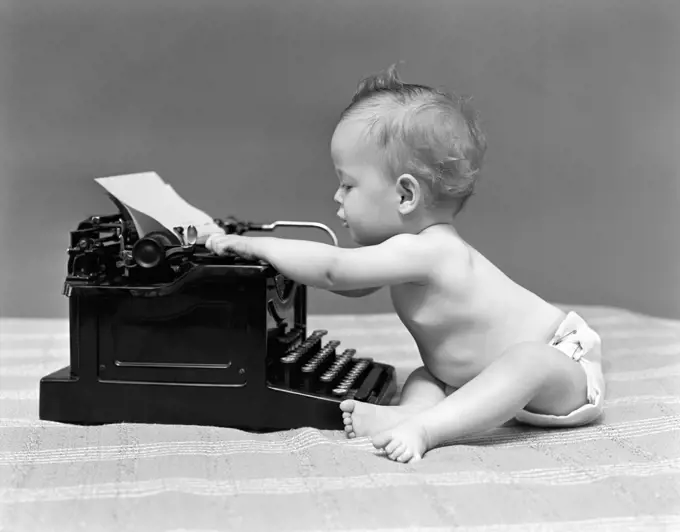 1940S Baby In Diaper Typing On Typewriter
