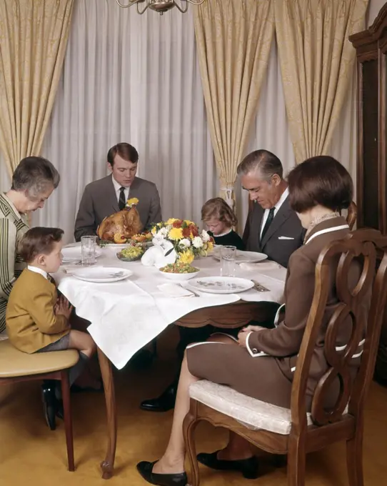 1960S 1970S Three Generation Family Saying Grace Prayer At Thanksgiving Dinner
