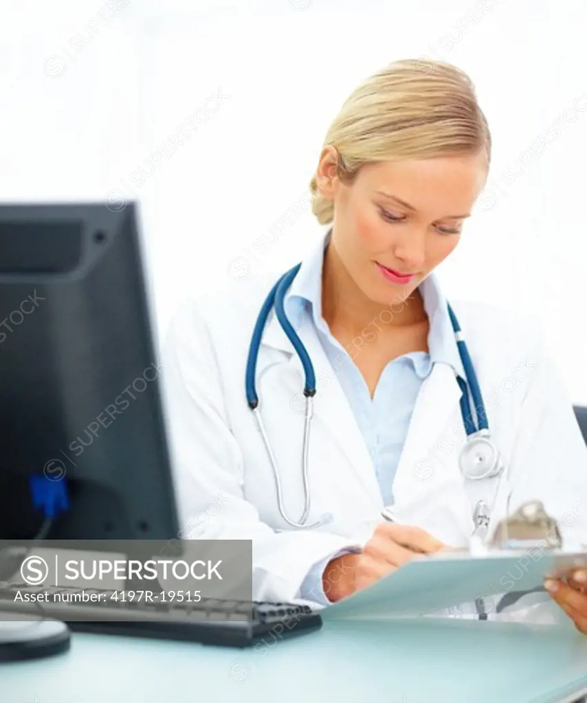 Beautiful young doctor working on her desk