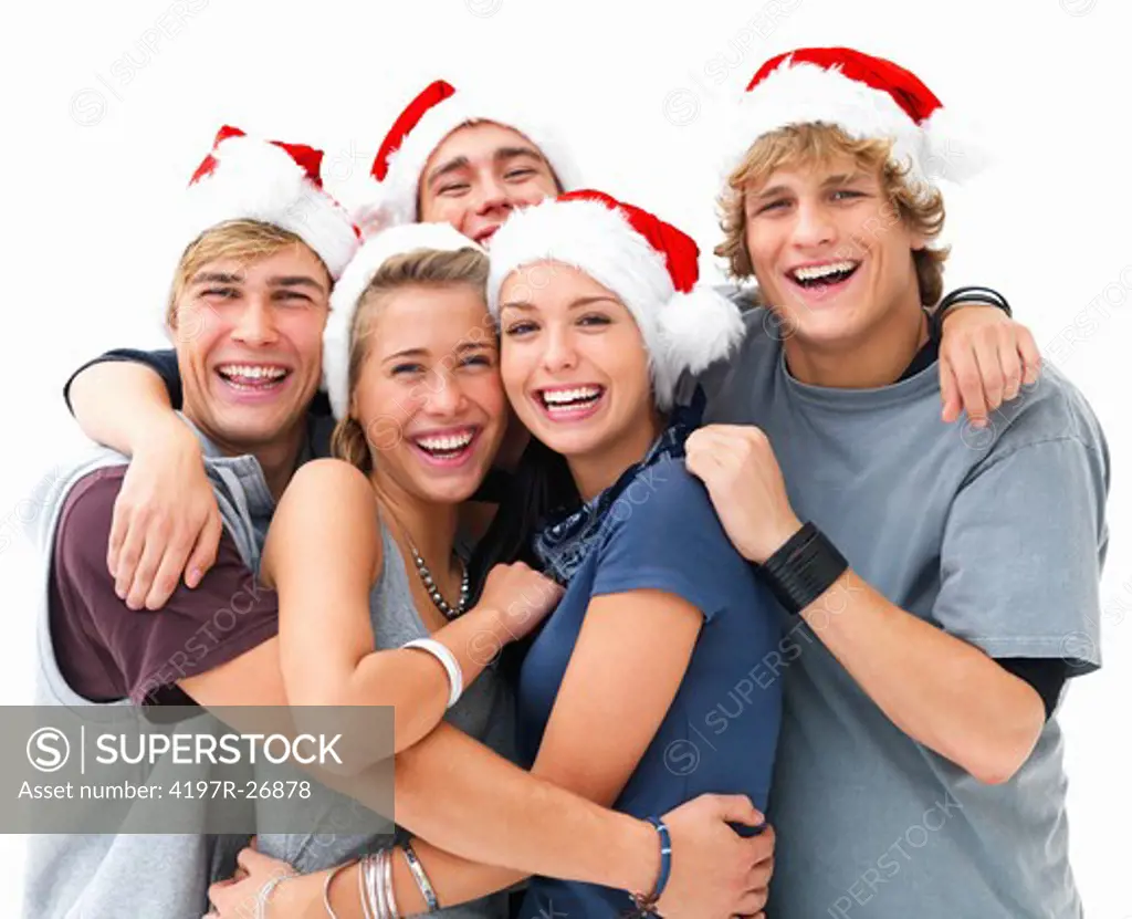 Closeup portrait of young smiling friends wearing Christmas hats