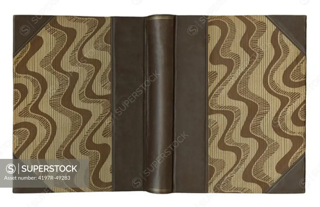 An open hardcover book with leather edges and a retro design - isolated