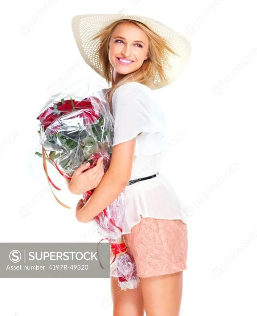 Cute young woman wearing a sunhat and holding a bouquet of red roses -  isolated on white