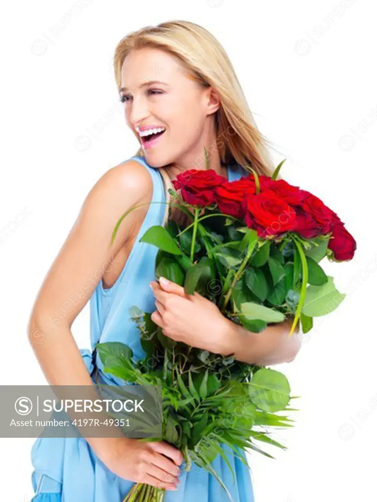 Young woman smiling while holding a bunch of red roses - isolated