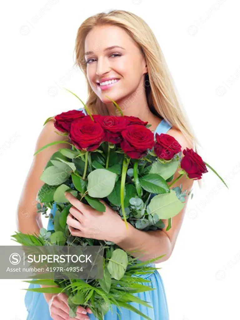 Gorgeous woman smiling while holding a bunch of red roses - isolated