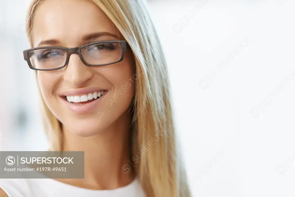 Portrait of beautiful laughing blonde with glasses on with copy space