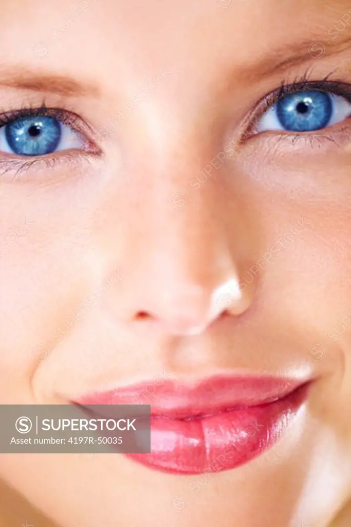 Closeup portrait of a striking young woman with luscious lips and deep blue eyes