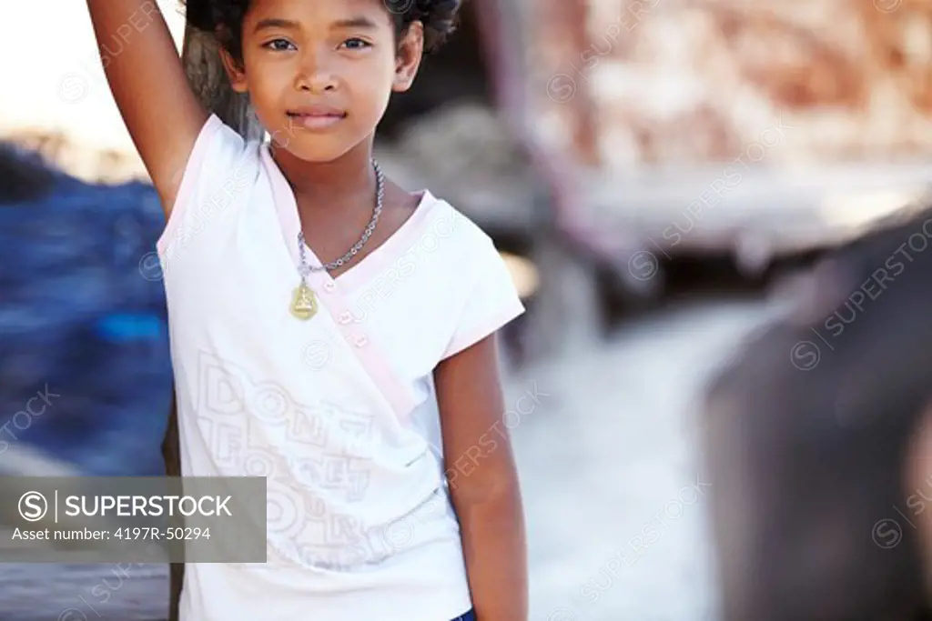 Portrait of a young rural girl from Thailand standing and looking