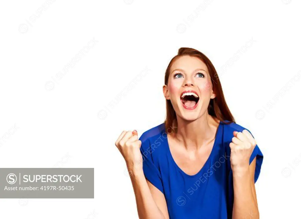 A young woman clenching her fists in joy - Isolated