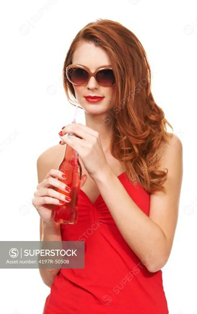 Portrait of a young woman holding a refeshing bottle of soda