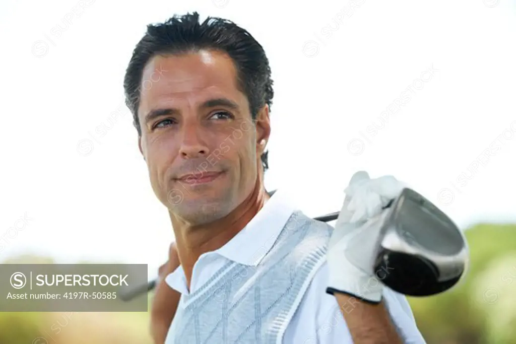 Portrait of an assured and confident mature golfer holding his club