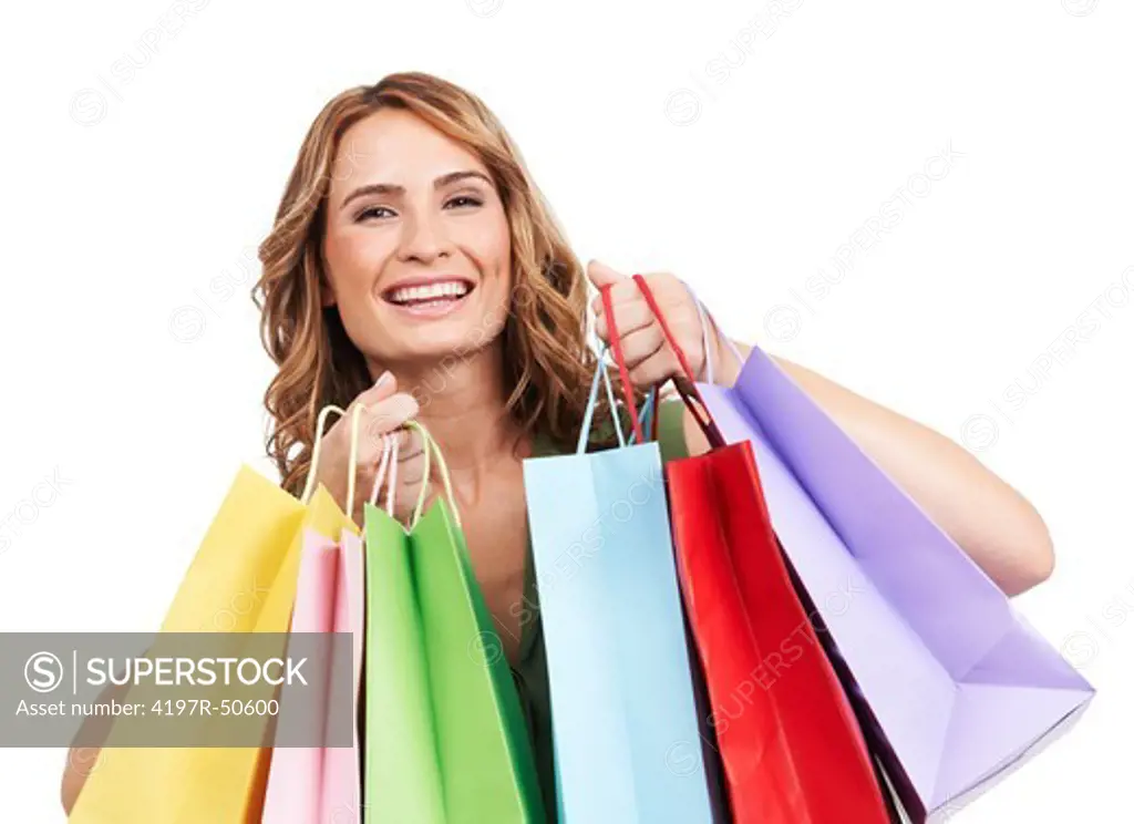 A pretty young woman celebrating after a successful shopping spree