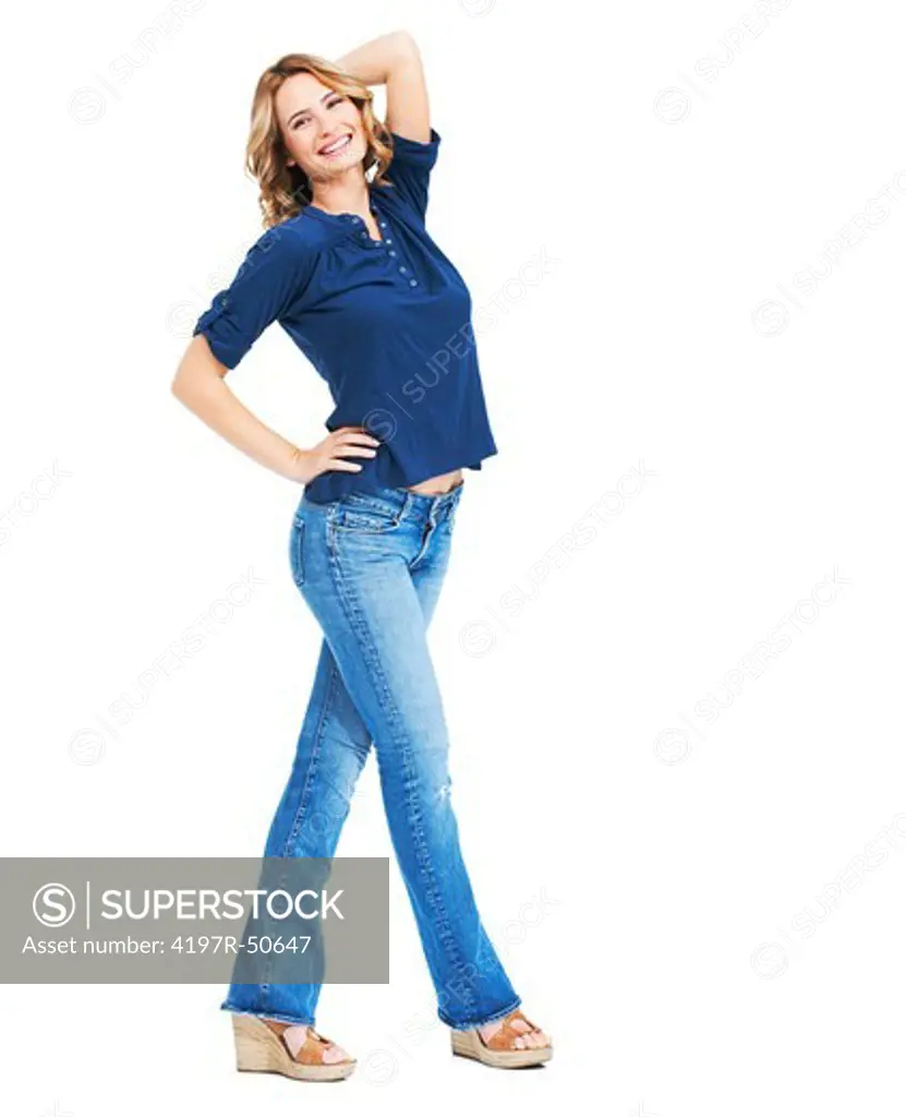 Full-length portrait of a confident young beauty posing against a white background
