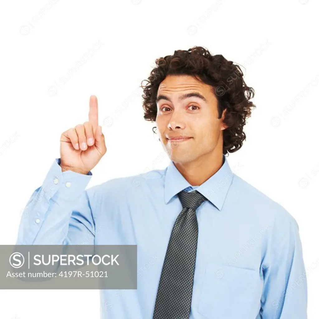 Portrait of a young businessman pointing upwards