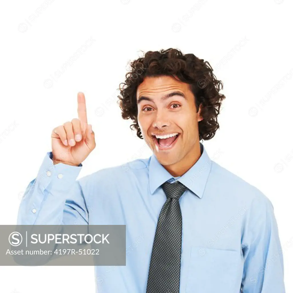Portrait of a young businessman pointing upwards