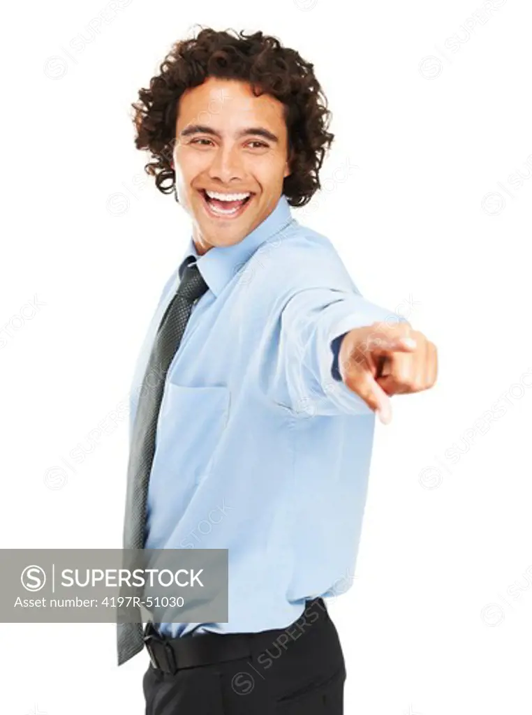 A young businessman pointing at something and laughing