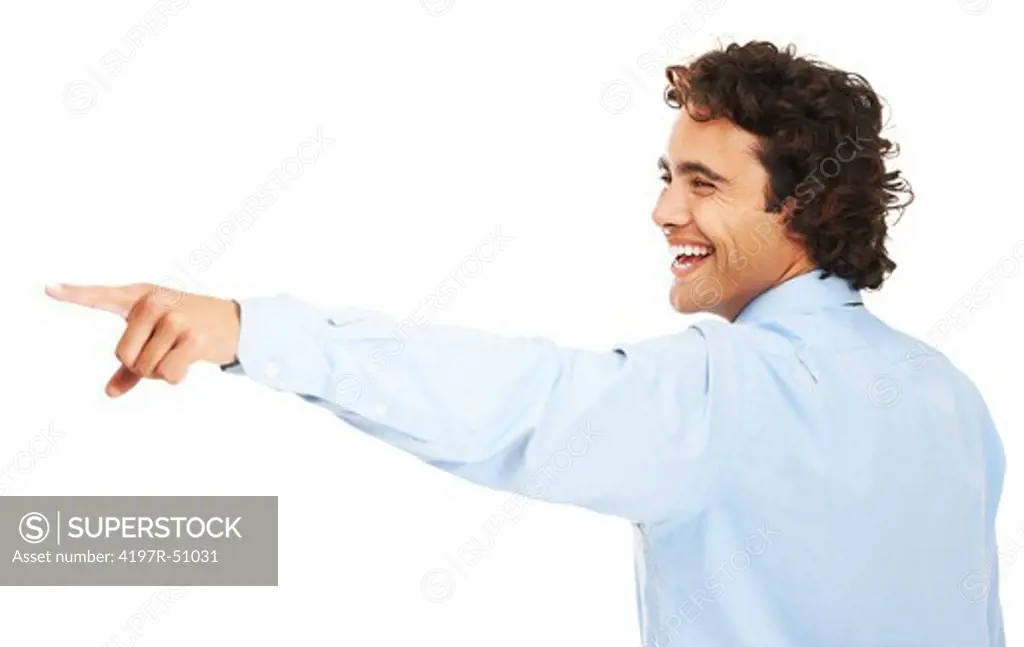 A young businessman pointing at something and laughing