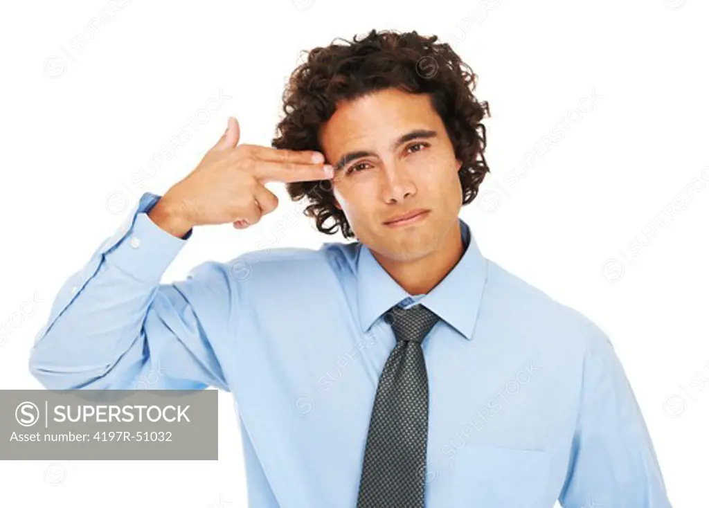 Portrait of a young businessman using his hand as a gun and placing at his temple