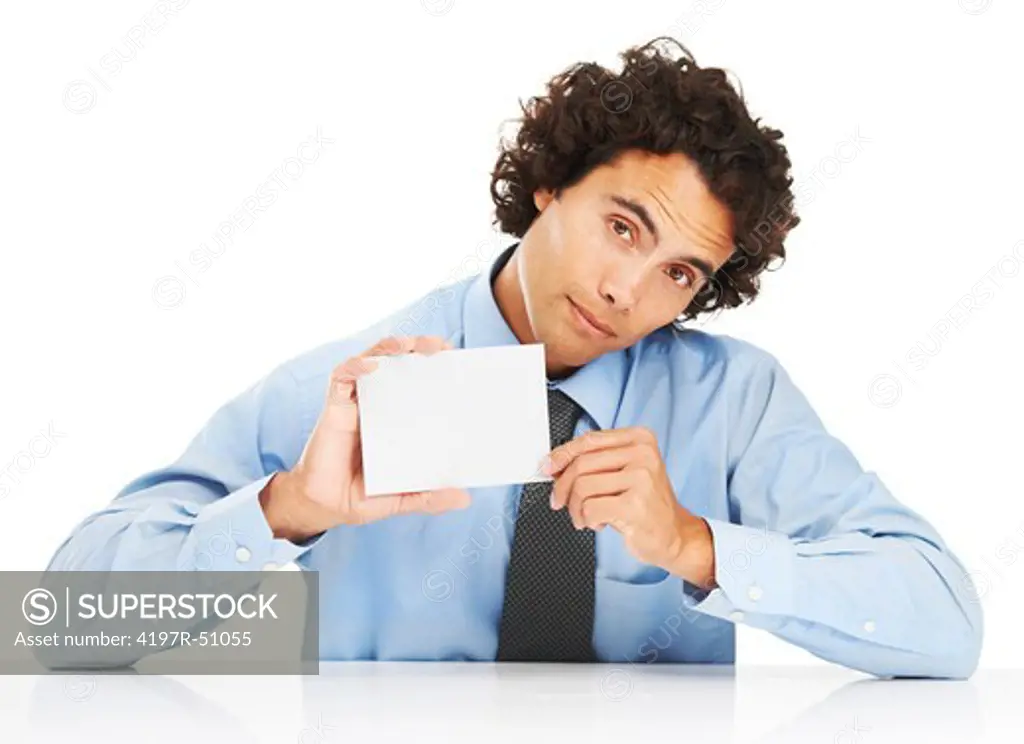 Portrait of a serious young businessman holding a blank card