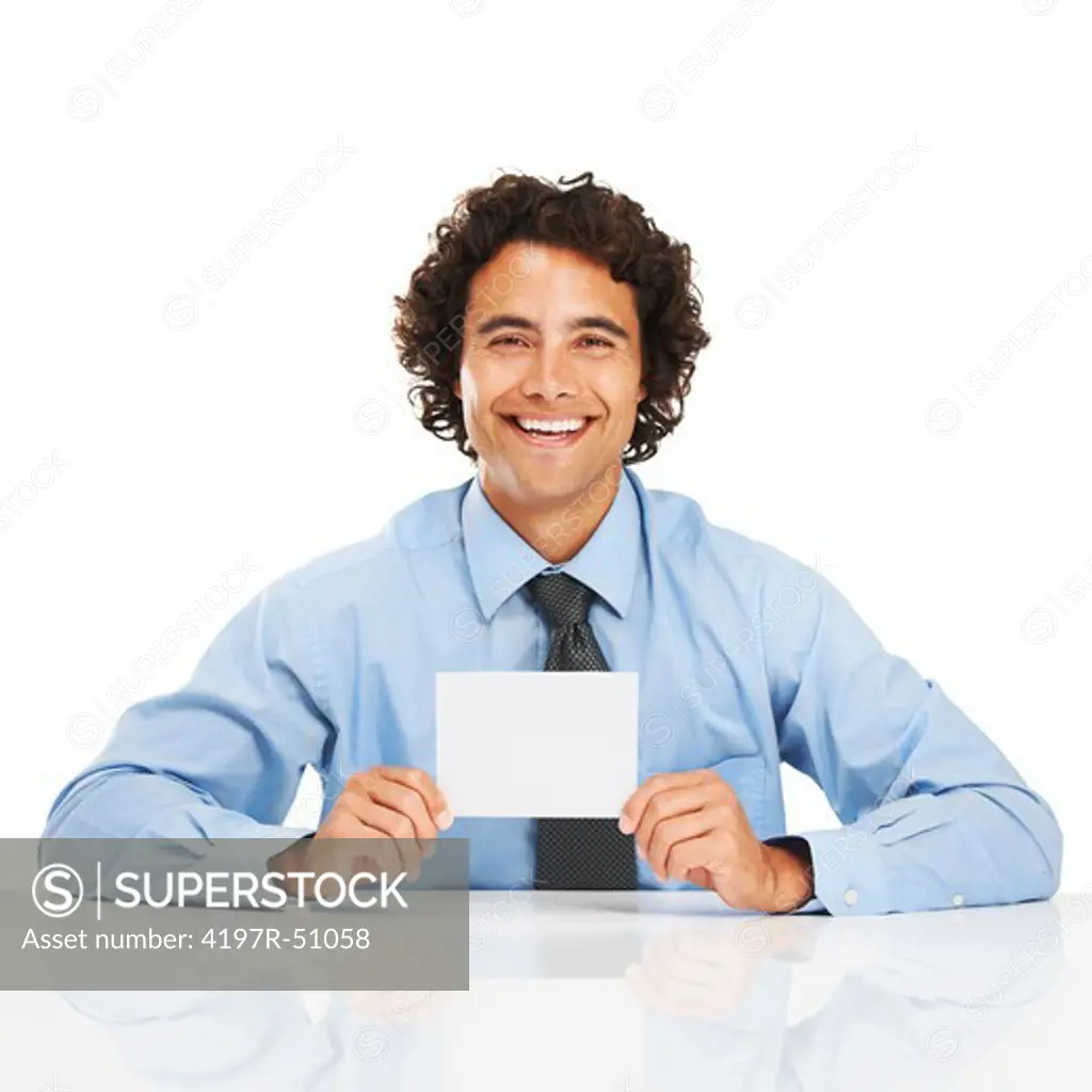 Portrait of a young businessman holding a blank card