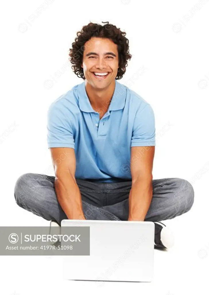Portrait of a young man sitting in front of his laptop