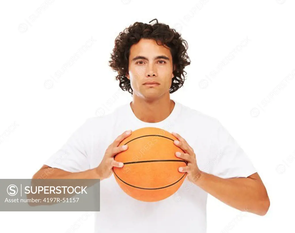 Portrait of a young man holding a basketball