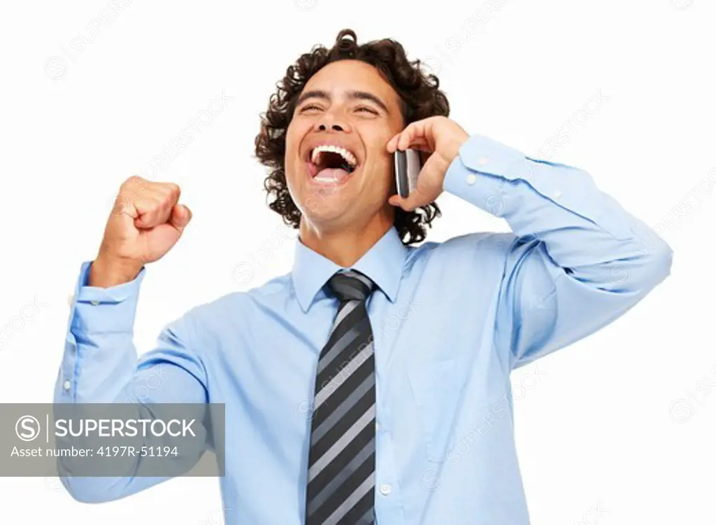 Ecstatic young executive on the phone while isolated on white