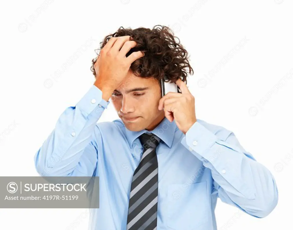 Young businessman taking a worrying phone call