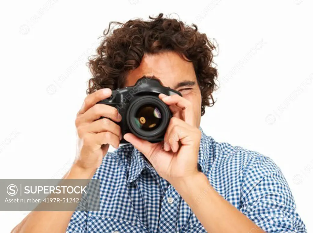 Closeup of a photographer focusing his camera on you - Isolated on white