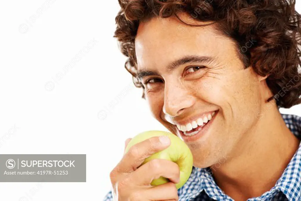 Closeup portrait of a young man about to take a bite out of an apple