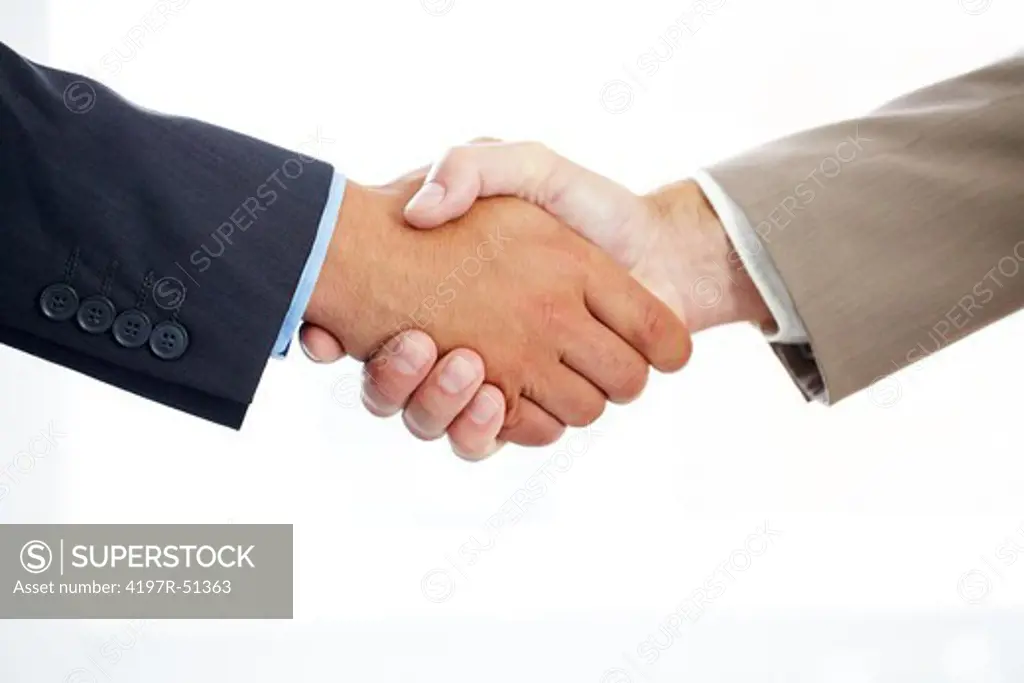 Cropped image of two businessmen shaking hands against a white background - isolated