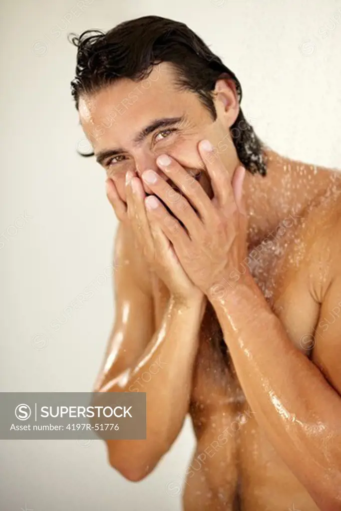 Portrait of a handsome young man enjoying a relaxing shower