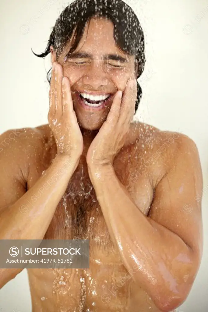 A handsome young man enjoying a relaxing shower