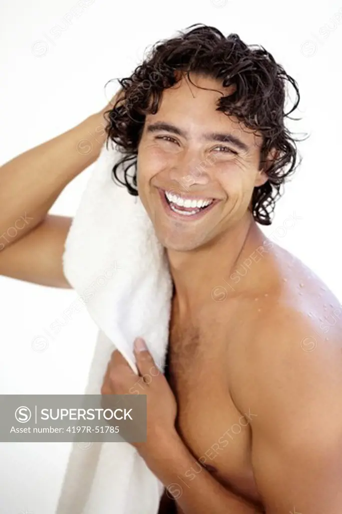 Portrait of a sexy young man drying himself after a refreshing shower