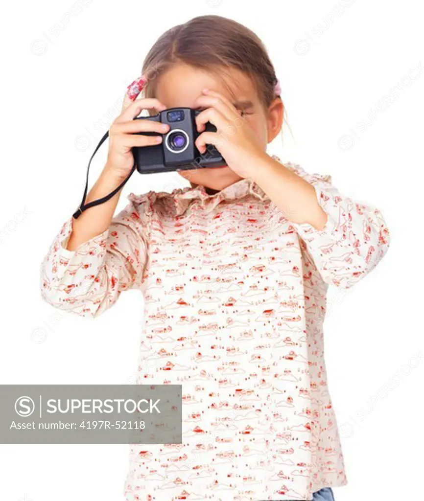 Pretty small girl playing as photographer isolated on white background