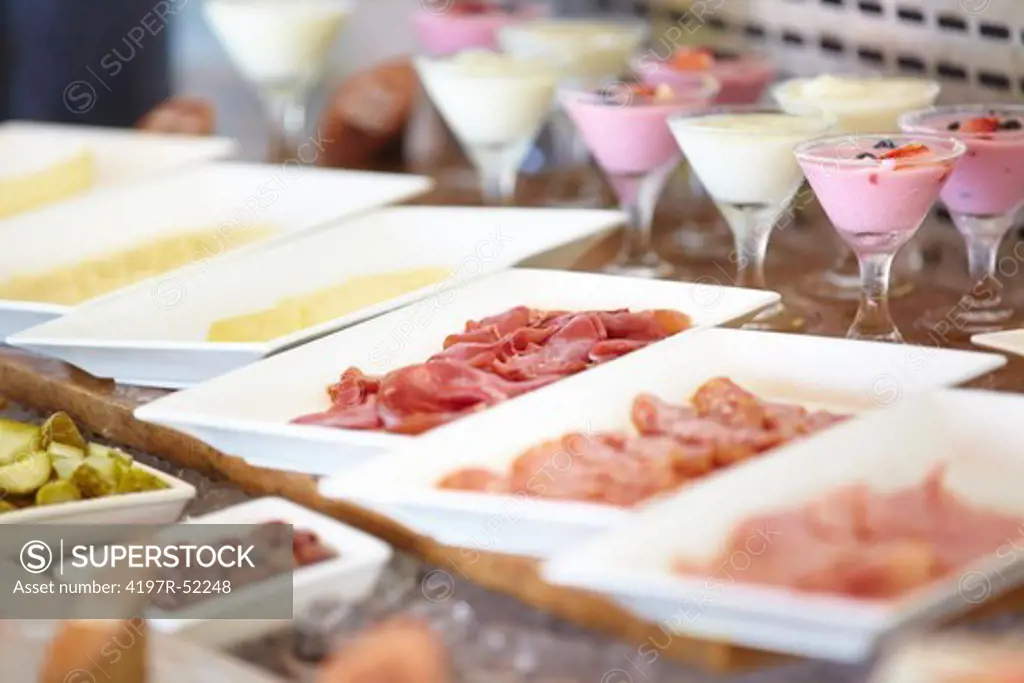 Fresh sliced meat served on buffet table
