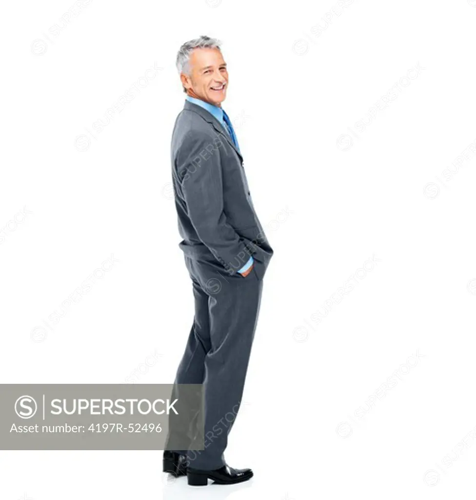 Full length of a mature business man with hands in pockets against white background