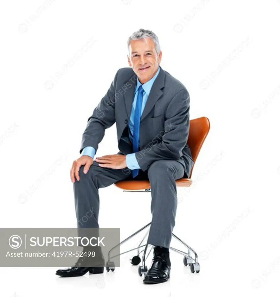 Portrait of middle aged businessman sitting on chair isolated over white background