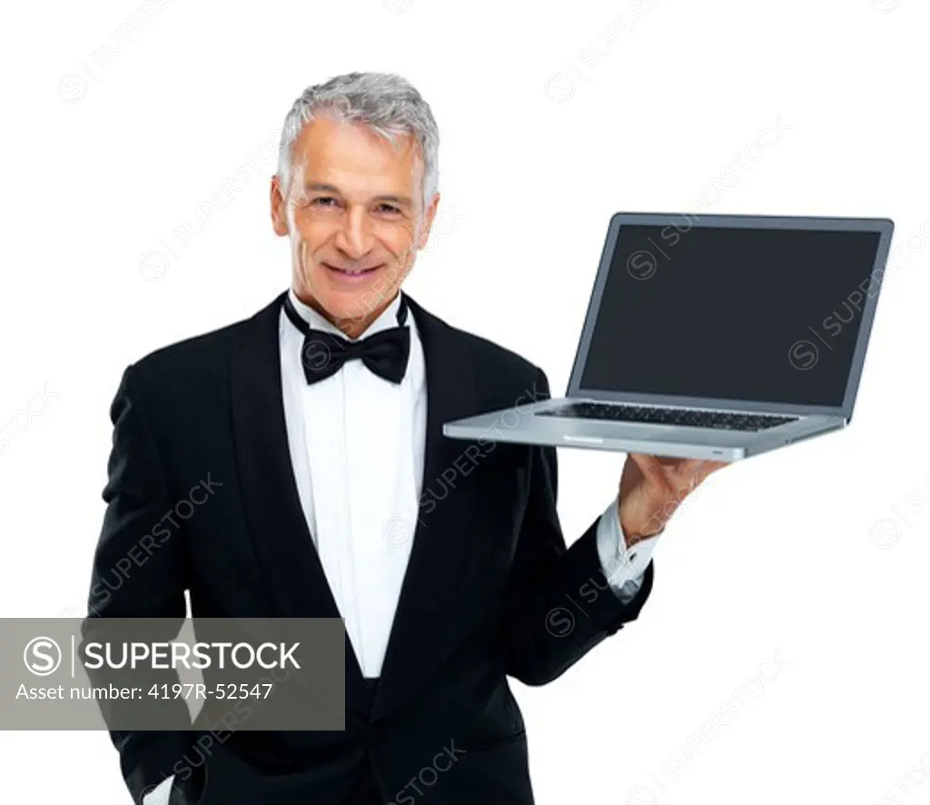 Portrait of senior male executive holding laptop on white background