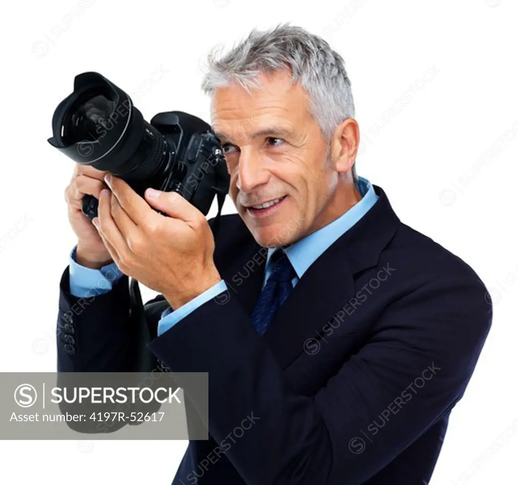 Elderly business man using a professional camera isolated against white background
