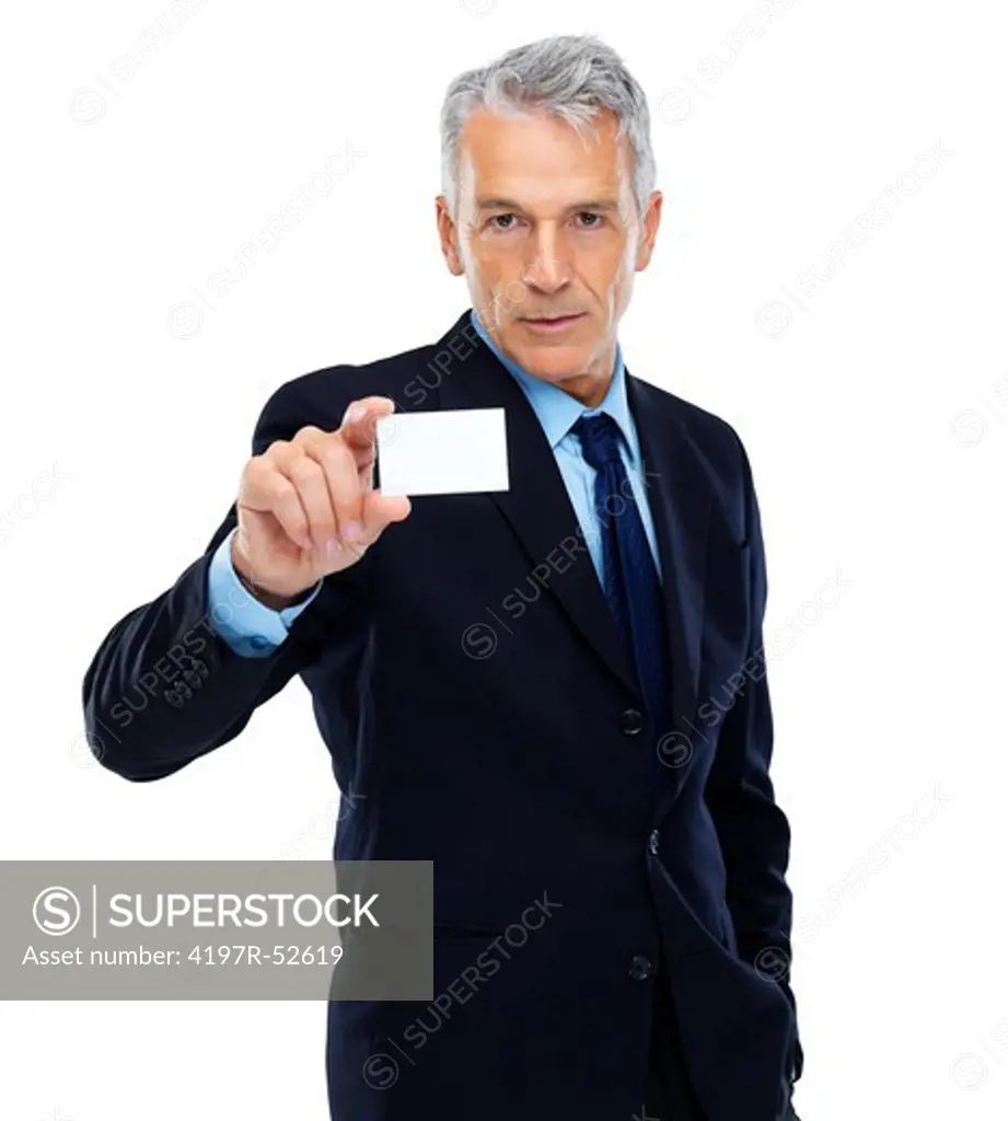 Confident mature businessman holding a blank business card against white background