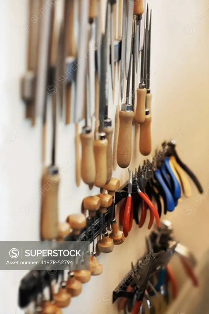 Tools hanging on a wall in a workshop