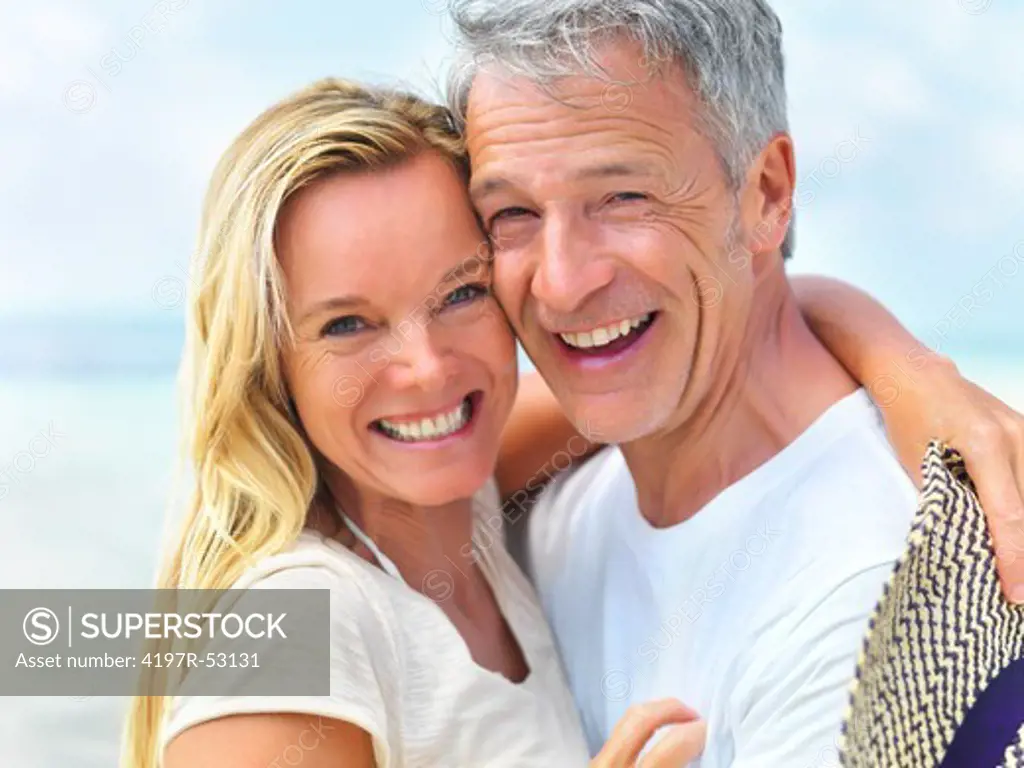 Portrait of romantic middle aged couple together smiling