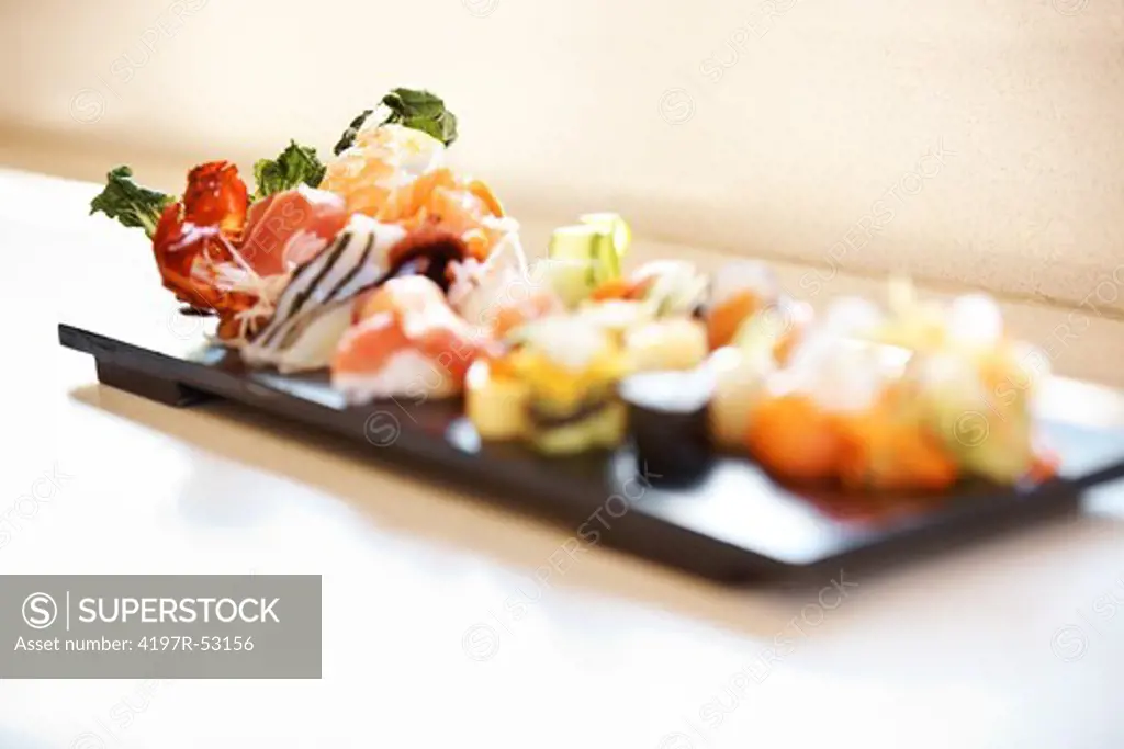 Image of delicious sushi platter served on a plate at restaurant