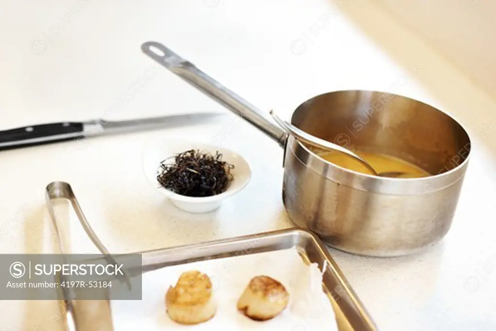 Image of hot caramel with cream puffs in restaurant kitchen